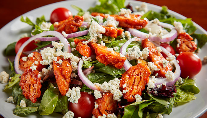 Try a buffalo chicken salad from Anduzzi's Sports Bar and Grill serving two wisconsin locations